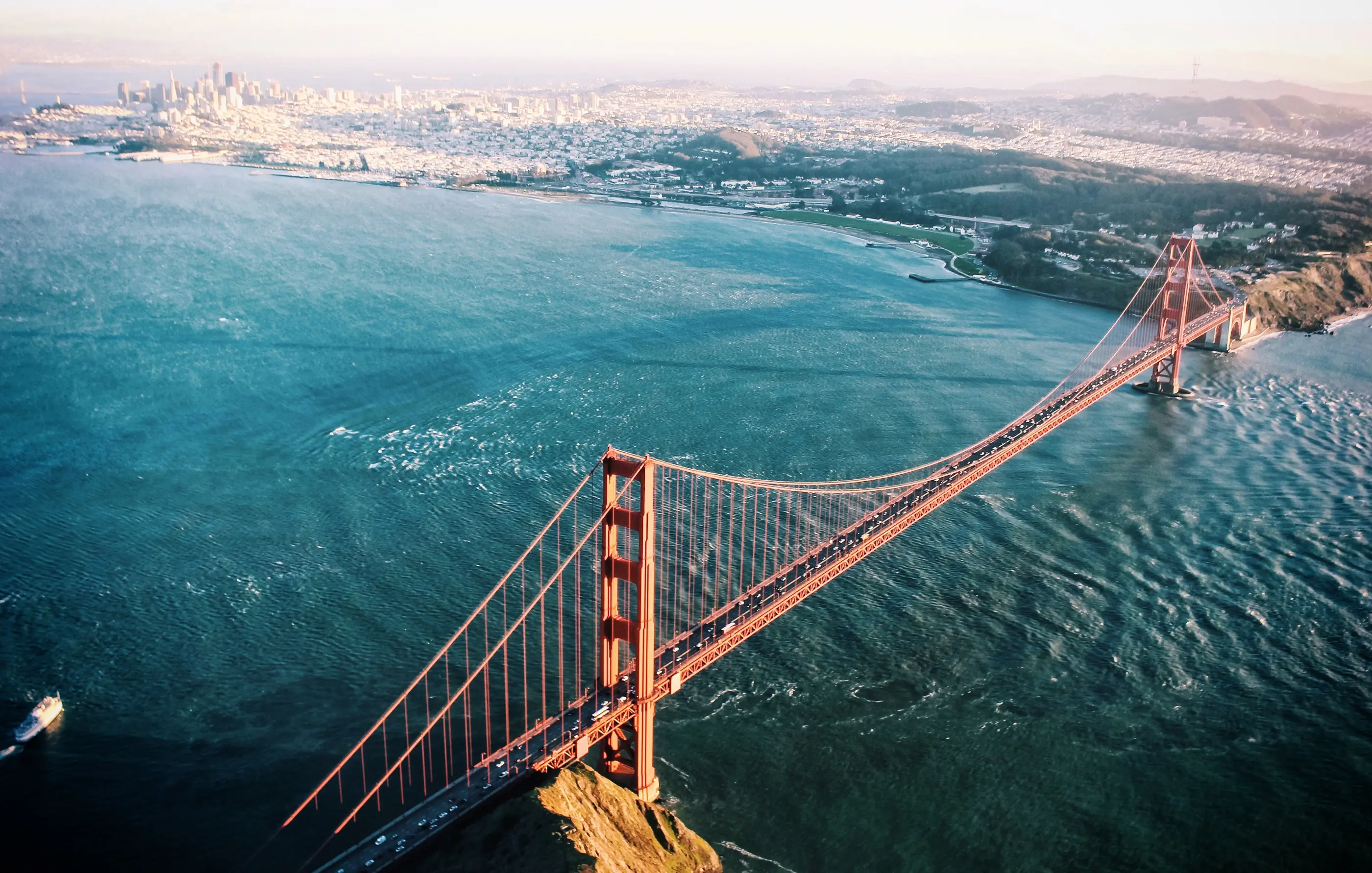A crisp aerial view of the Golden Gate Bridge, Marin Headlands, and San Francisco Bay